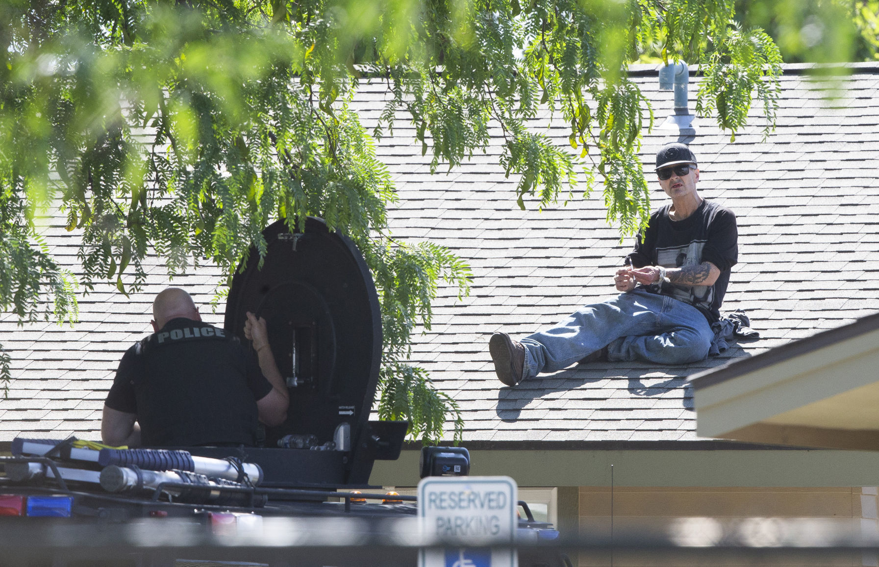 Police negotiate with man on roof